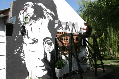 24 Jorge painting the Abbey Road album cover on the wall next to his John Lennon IMG_9135.jpg